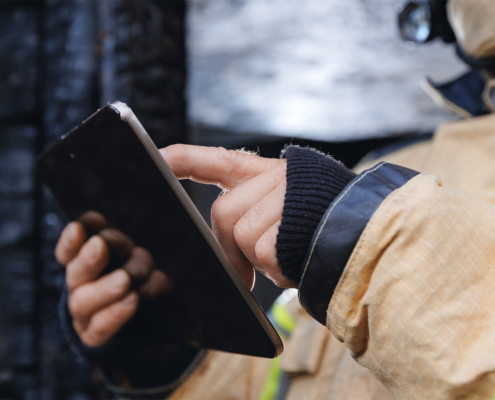 Side view of firefighter with clipboard